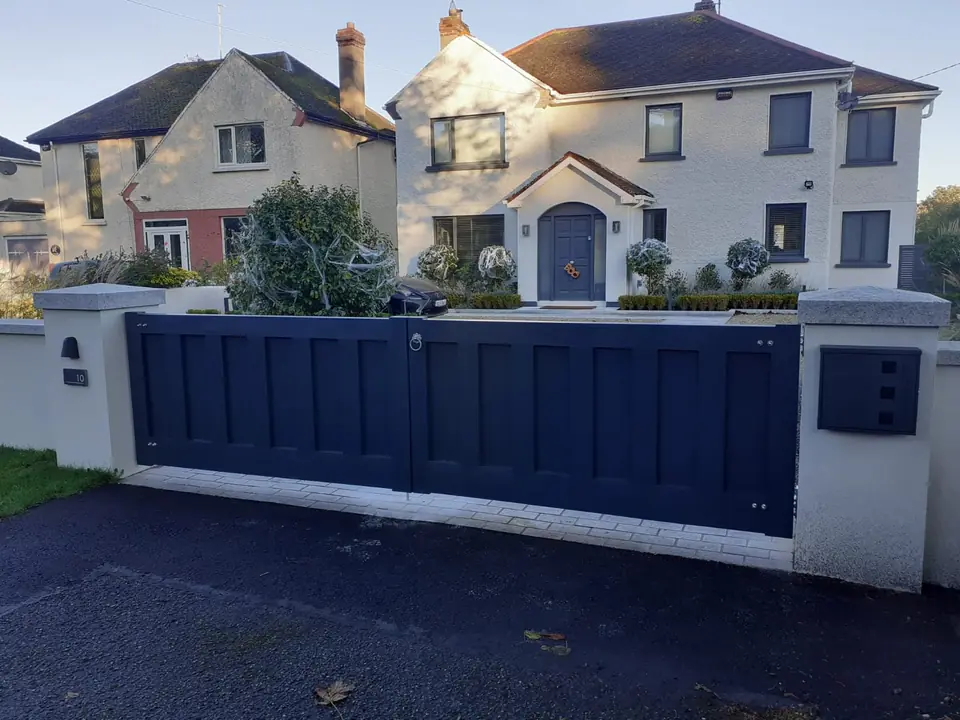Bespoke dark-finish driveway gates made by PJ Gates & Automation