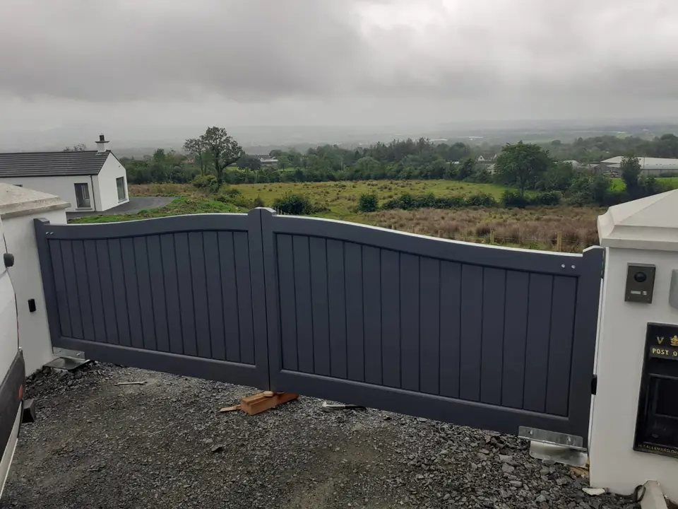 Bespoke dark-finish driveway gates made by PJ Gates & Automation