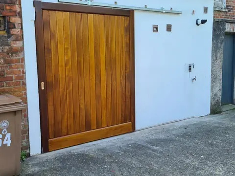 Bespoke painted driveway gates made by PJ Gates & Automation