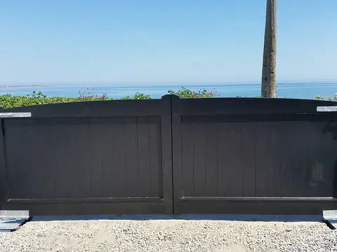 Bespoke painted driveway gates made by PJ Gates & Automation