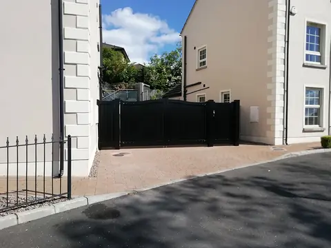 Bespoke painted driveway gates made by PJ Gates & Automation