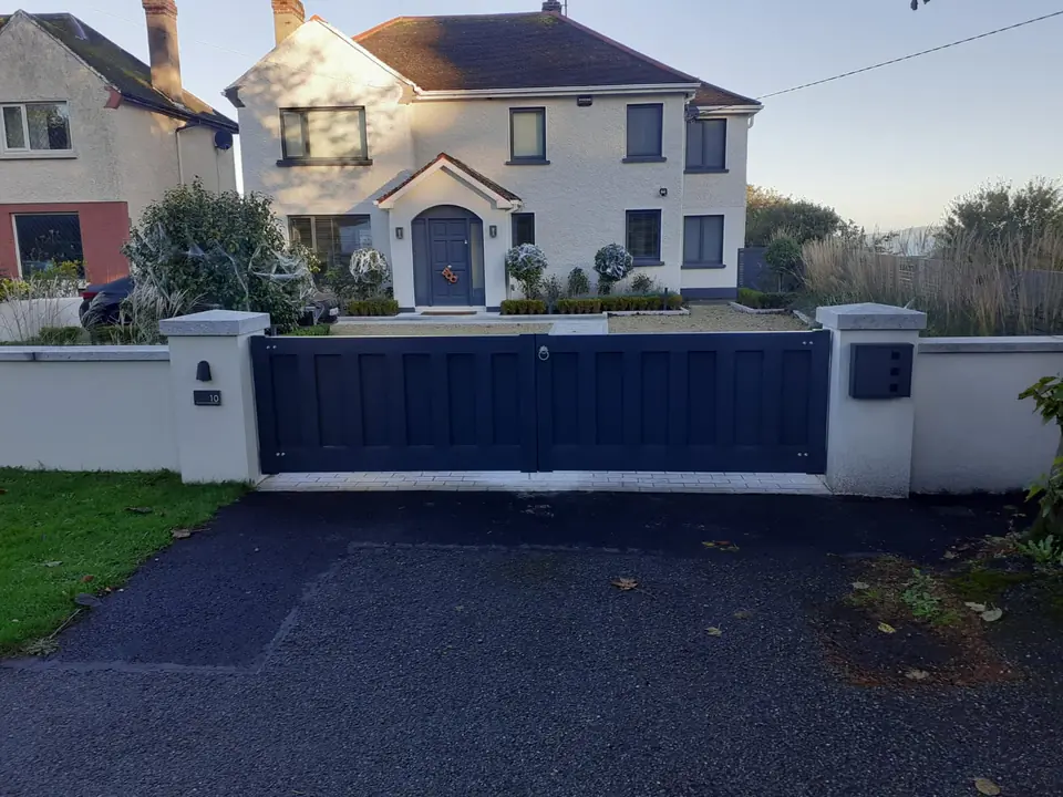 Bespoke dark-finish driveway gates made by PJ Gates & Automation