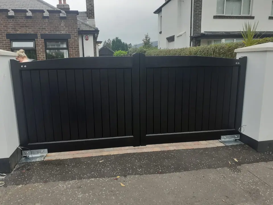 Bespoke dark-finish driveway gates made by PJ Gates & Automation