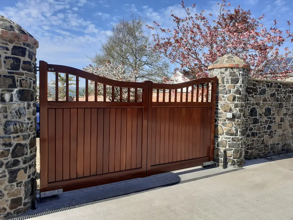 Iroko hardwood gates with a spindle top